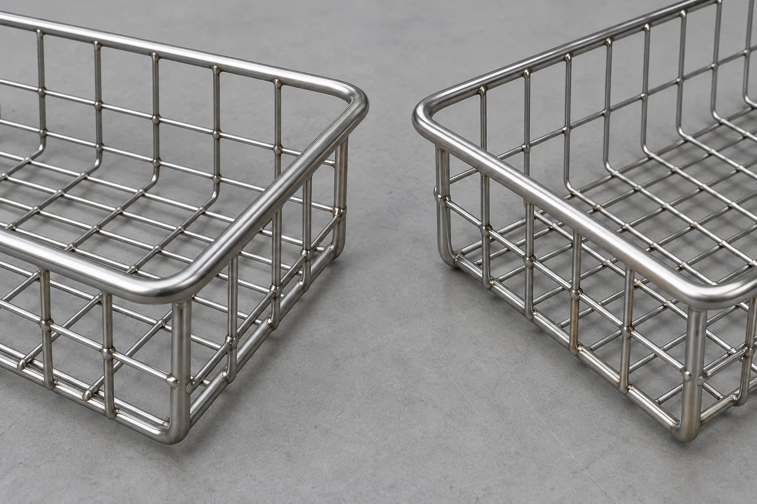 Wire storage basket joint showing a thicker perimeter wire crossing fine infill wires