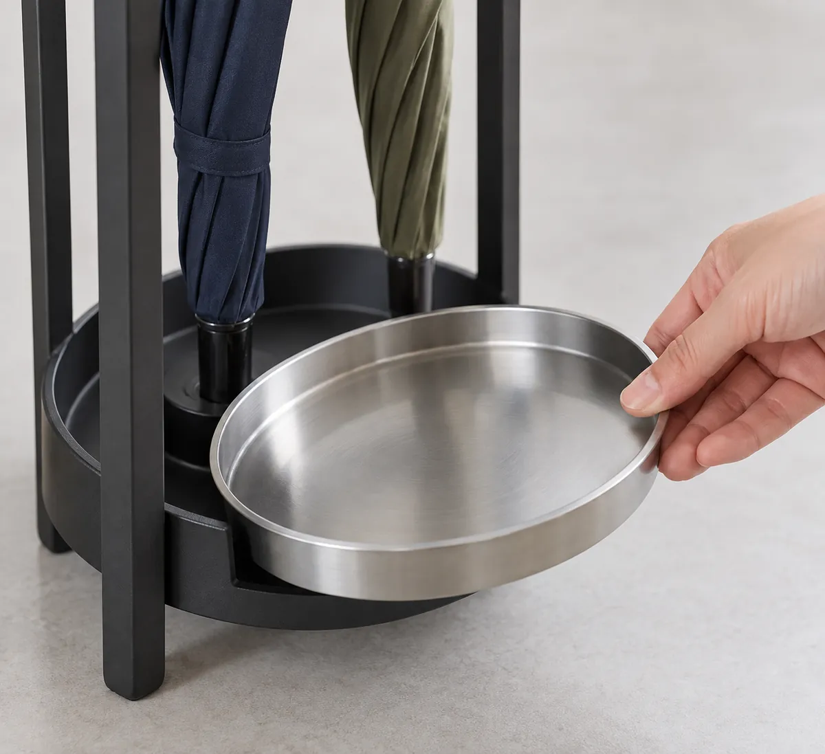 Close-up illustrating a buyer review point for metal umbrella stand drip tray specification.