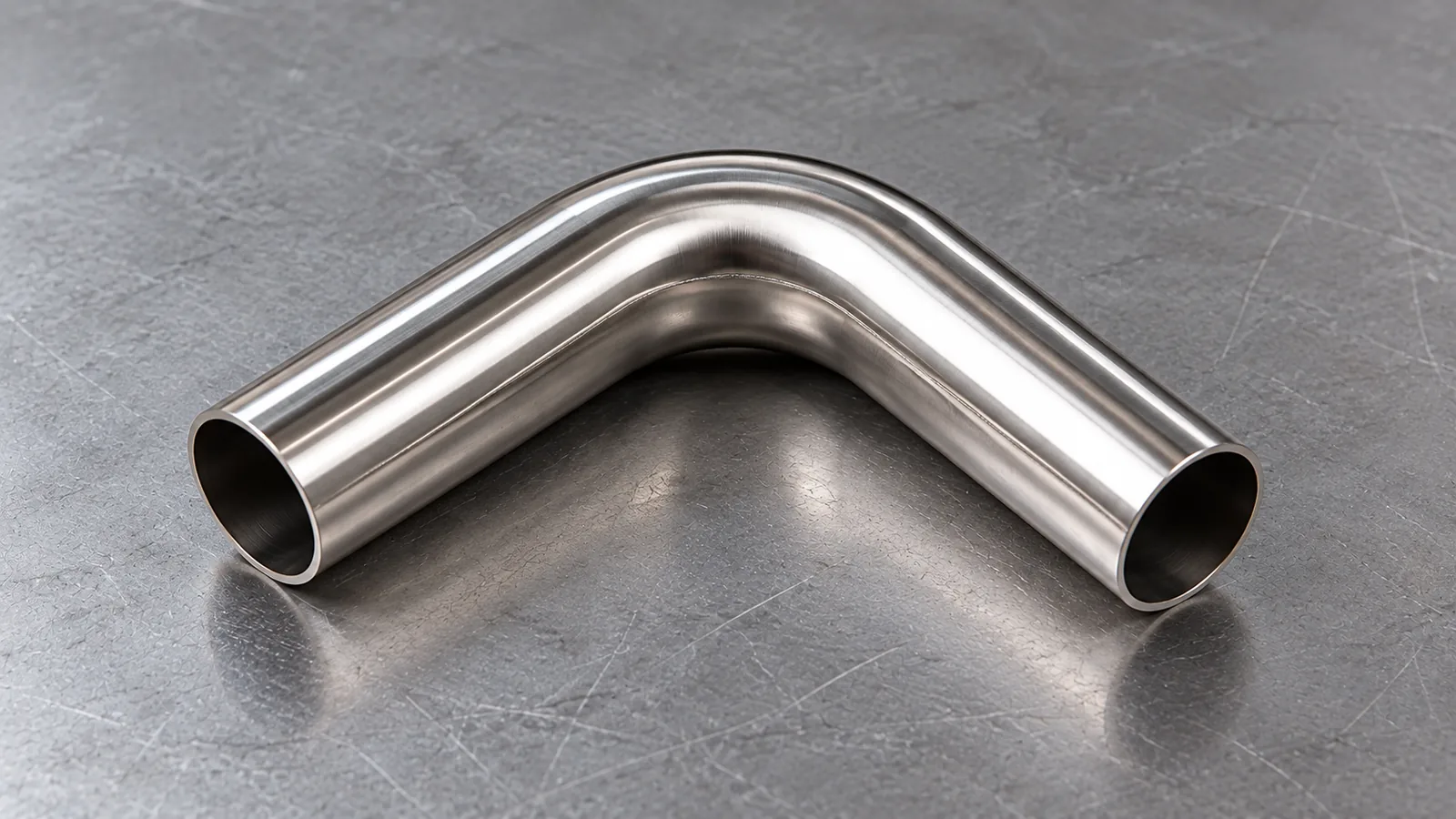 Photorealistic bent stainless tube used in a towel rack, with the original longitudinal tube seam subtly visible near the bend, realistic controlled curve.
