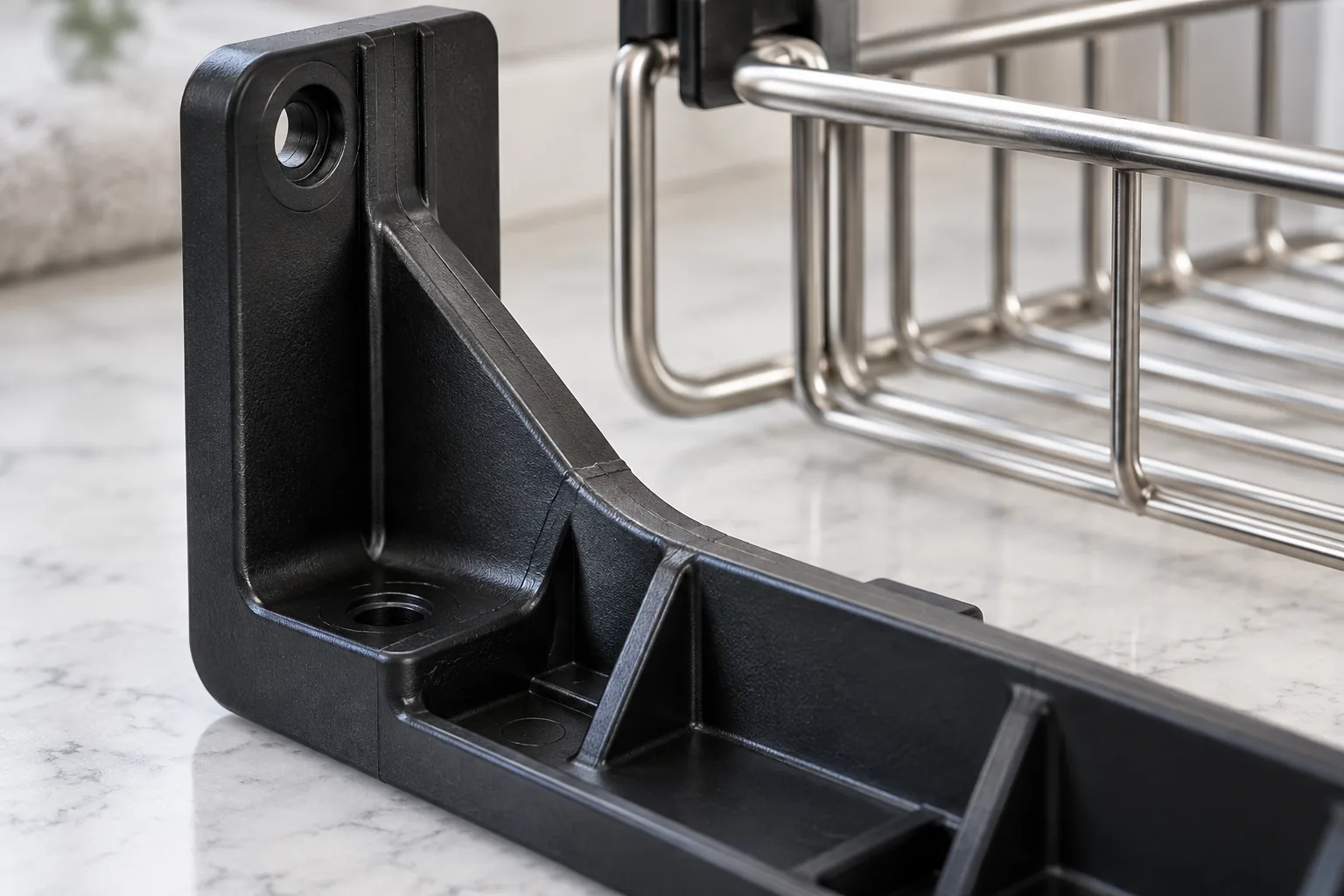 Unbranded molded mounting bracket samples with a subtle weld-line location for supplier review