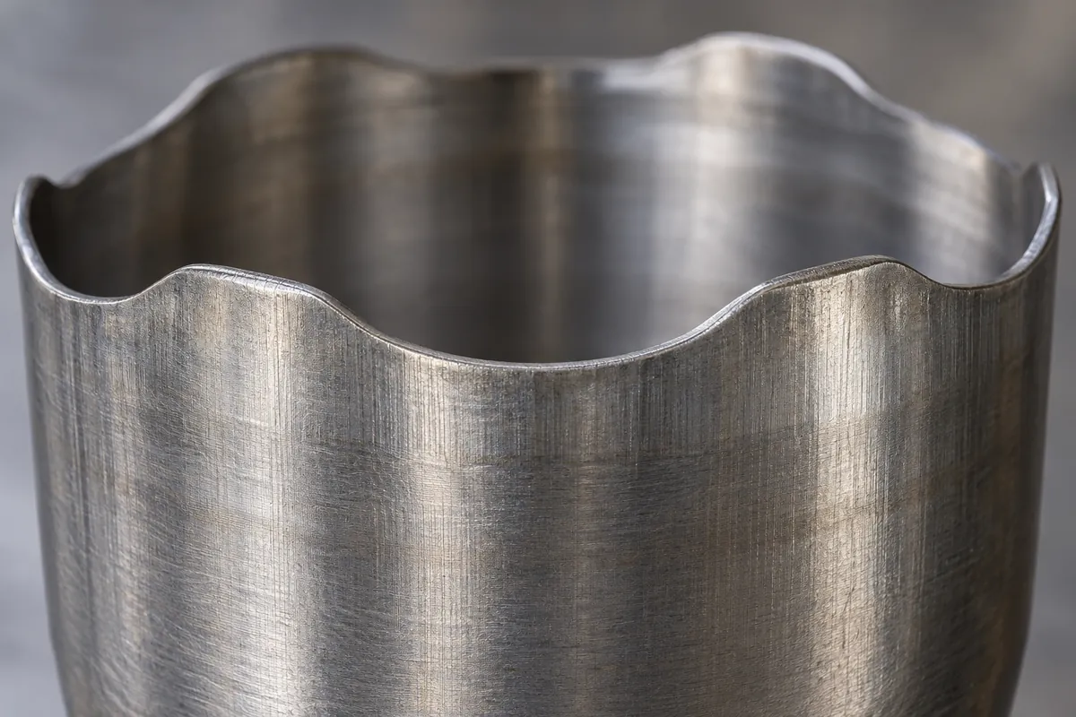 Manufacturing detail relevant to deep drawing earing anisotropy blank orientation