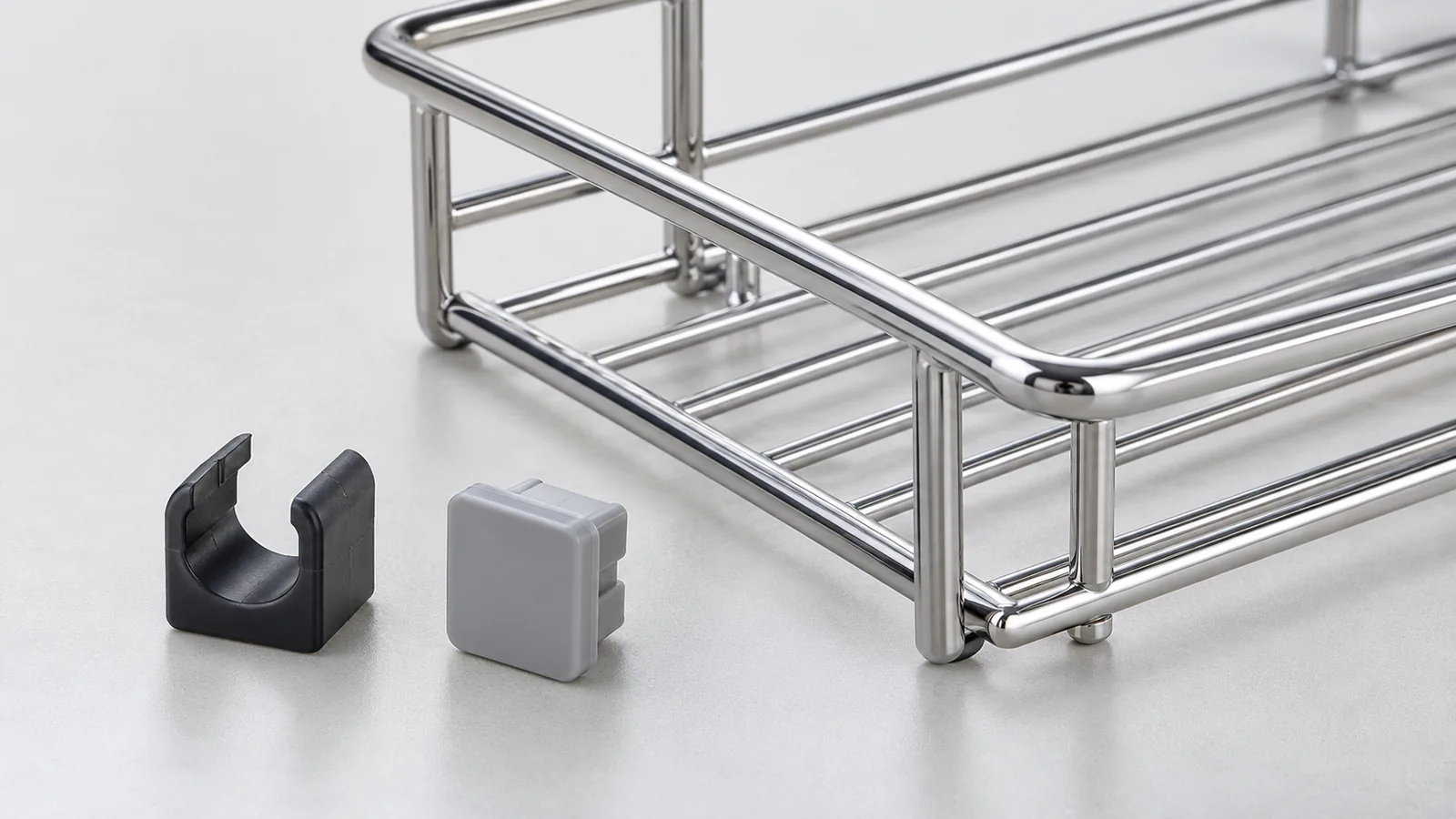 Generic purchased polymer clips and covers beside a metal home-storage rack sample