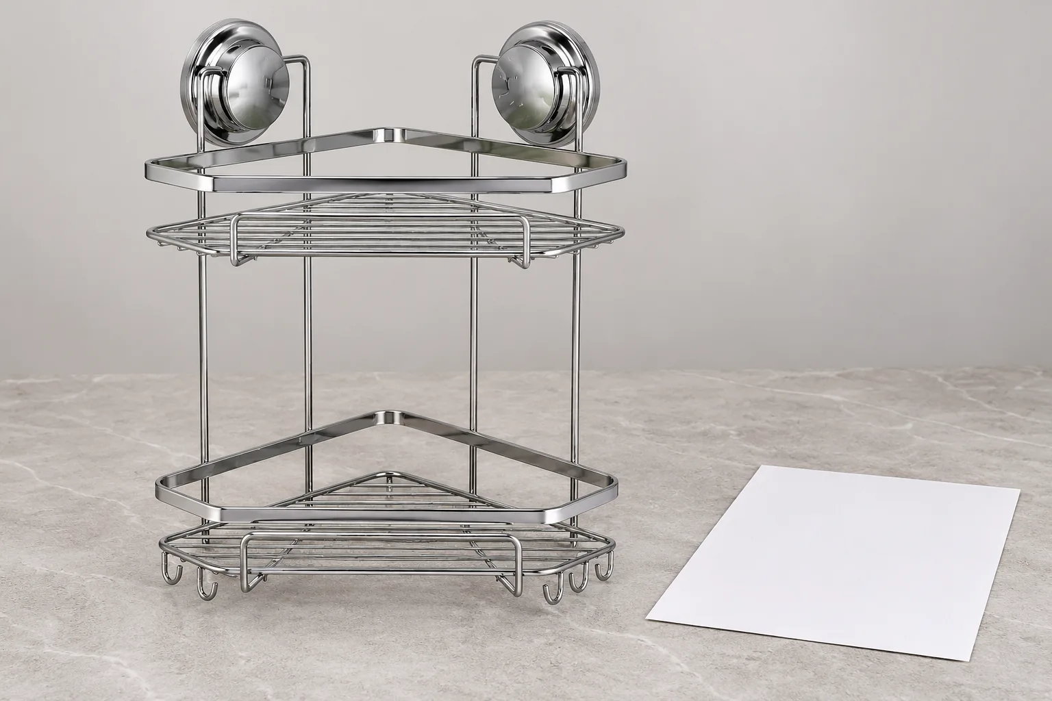 Two-tier chrome corner shower basket beside a version-controlled shipment handoff sheet