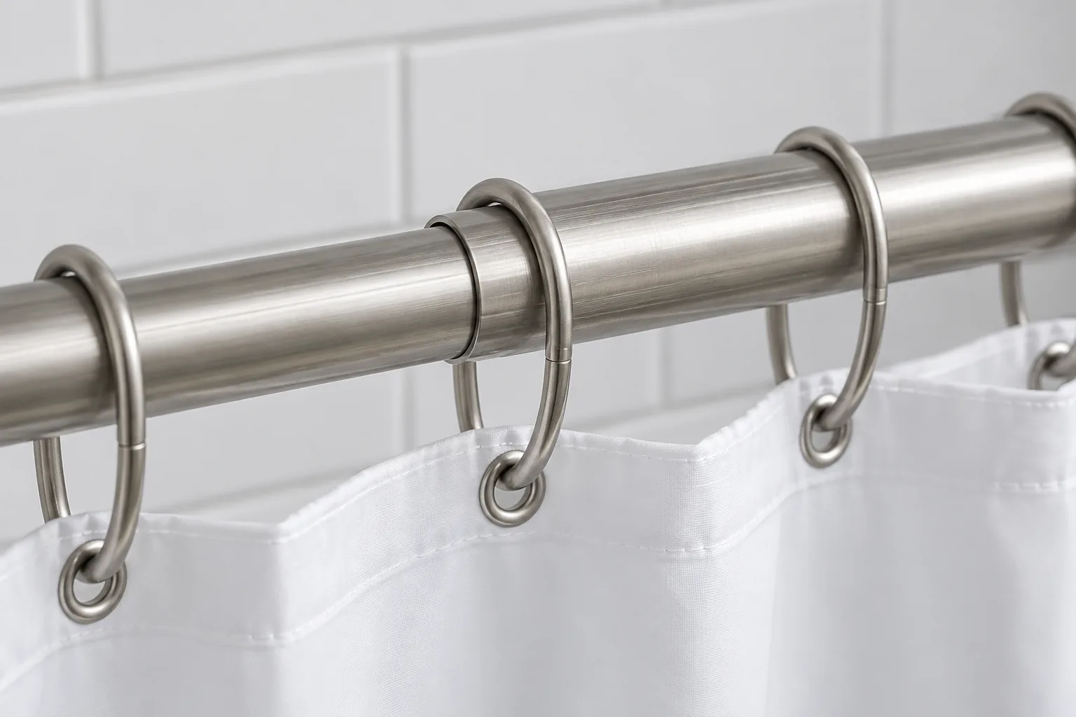 Conceptual shower curtain rings at the overlap joint of a telescopic shower rod