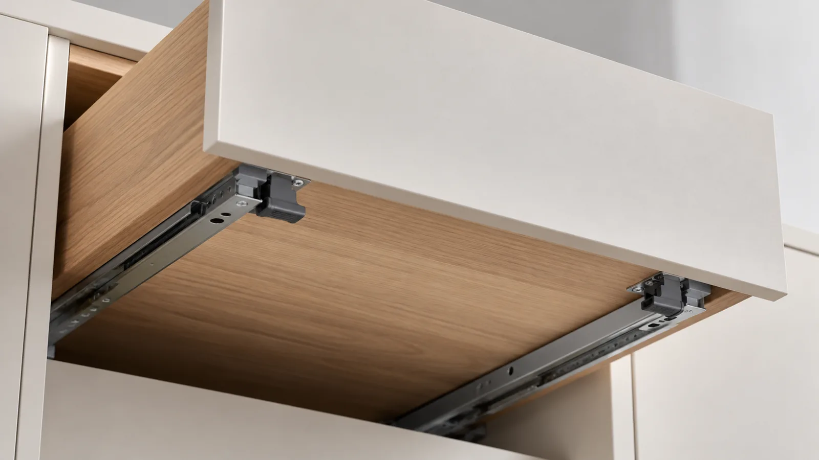 Conceptual cabinet drawer underside with a matched pair of undermount locking clips engaging concealed runners; illustrative buyer-education image.