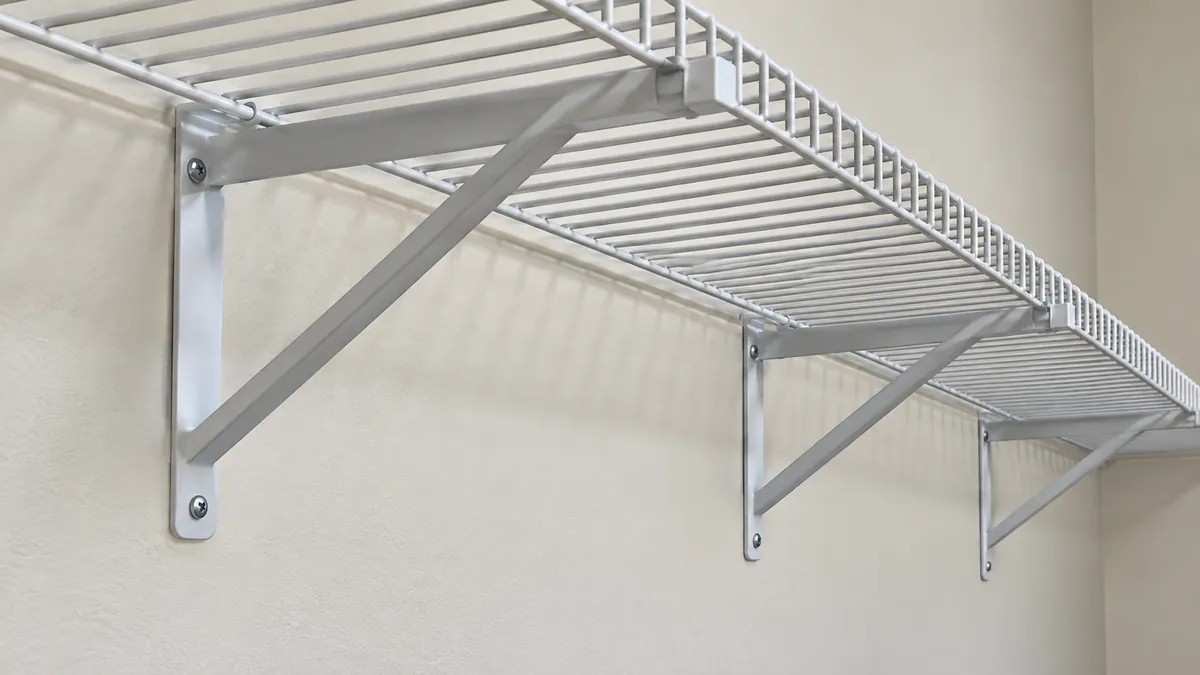 Underside view of wire shelf contact points and brackets; spacing is system-specific.