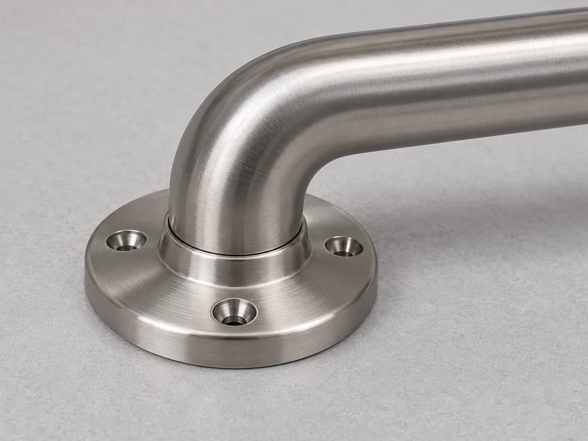 Close-up of a generic grab-bar sample showing the bar-to-flange joint as a loose product configuration